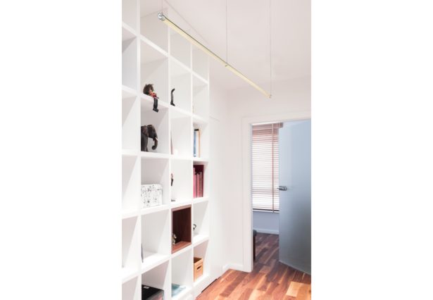White book shelf in office with wooden floor
